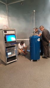 MI technicians installing and commissioning electrical metrology and transformer testing equipment.